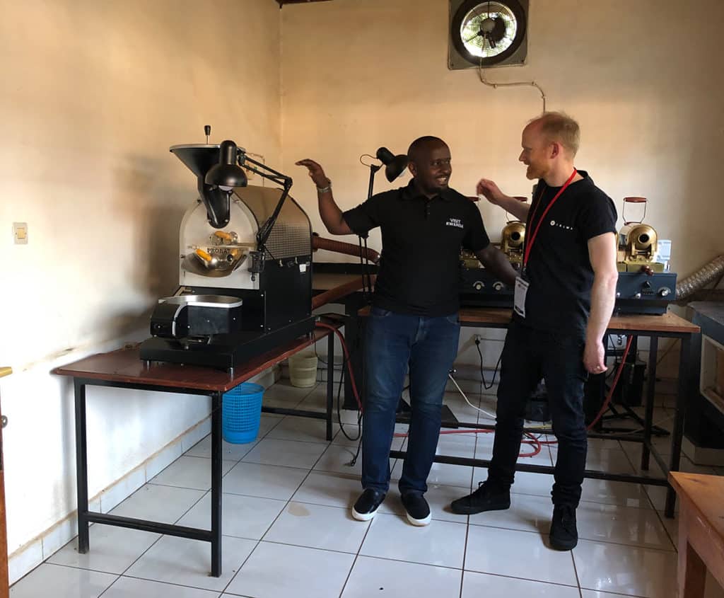 Alex in Rwanda at sample roasting lab