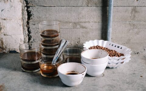 Photo of used coffee cupping equipment. The case for simplicity in sample roasting.